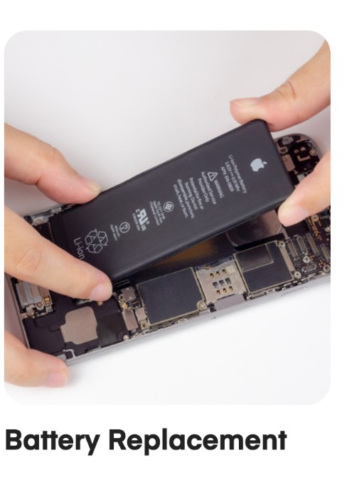 Technician fitting a genuine replacement battery